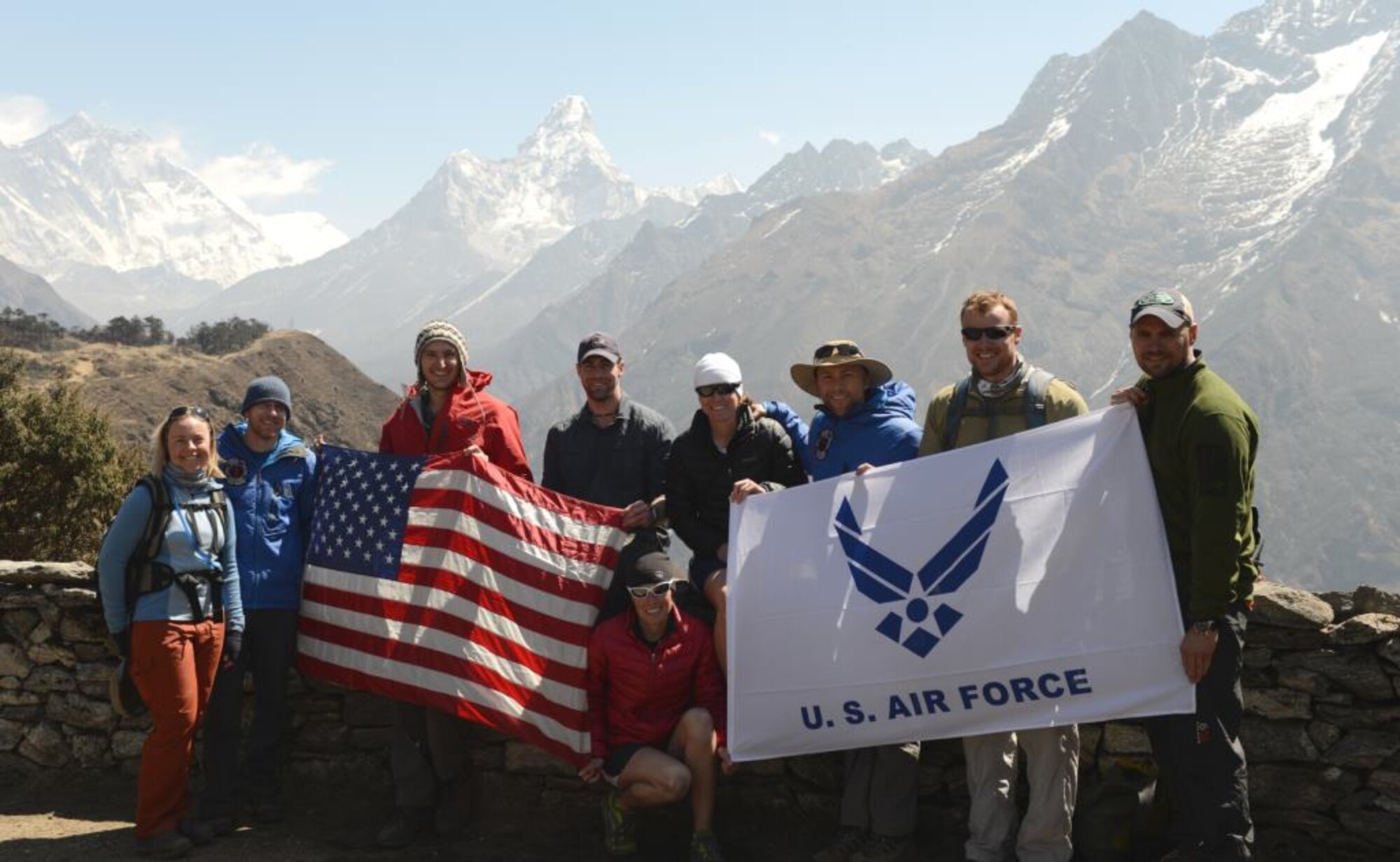 Part of the U.S. Air Force Seven Summit team smiles for a group photo in front of a Himalayan mountain range in Deboche, Nepal. A team of six active-duty Airmen is currently on their way to climb Mount Everest, the highest mountain on Earth. (Courtesy photo/USAF Seven Summit Challenge) 