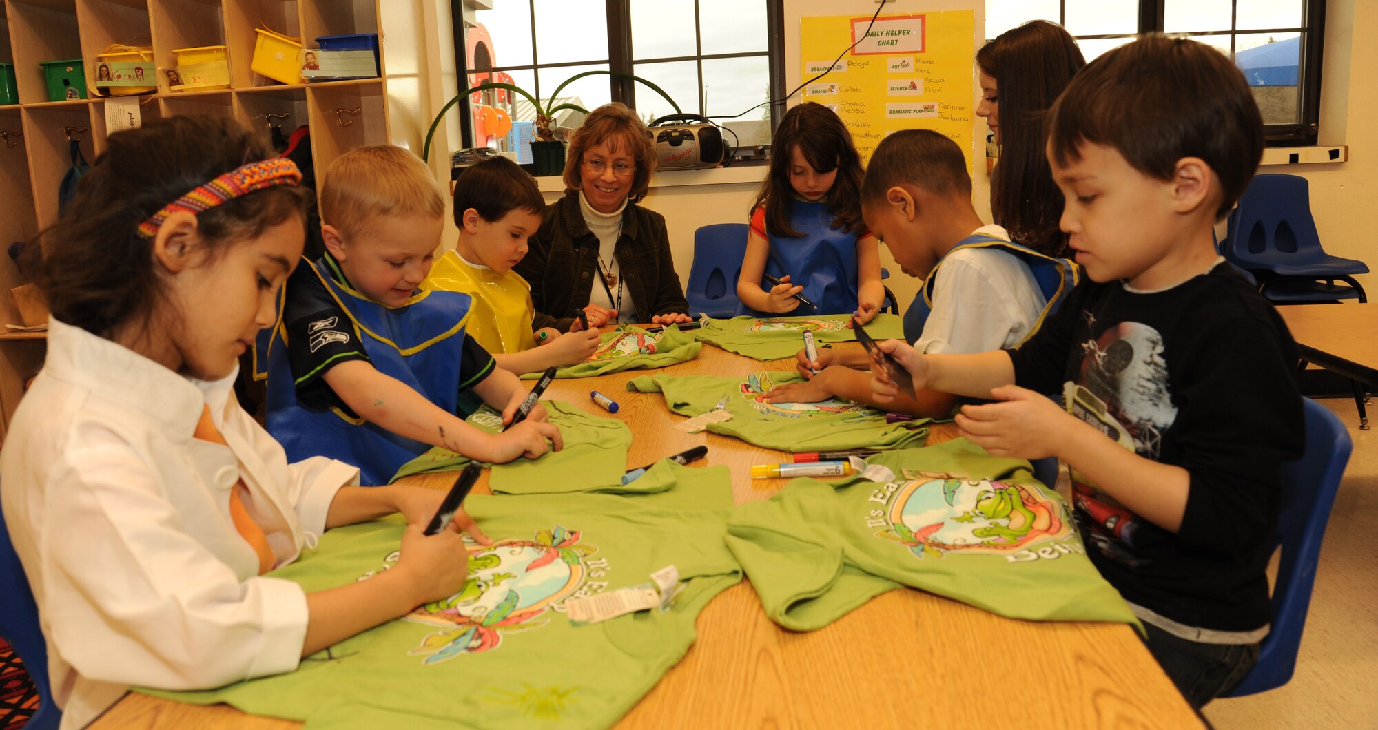 A group of kindergarteners decorate t-shirts in celebration of Earth Day at the Child Development Center at Fairchild Air Force Base, Wash. April 10, 2013. The children are going to wear their t-shirts on Earth Day, which is observed on April 22.  (U.S. Air Force photo by Senior Airman Samantha Krolikowski)