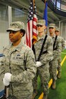 With the U.S. flag in hand, Senior Airman Daniel Sellstrom prepares to lead an Honor Guard colors detail Feb. 21, 2013, at Grand Forks Air Force Base, N.D.  Sellstrom is currently training to become a ceremonial guardsman for the Air Force Honor Guard at Joint Base Anacostia-Bolling, Washington, D.C. (U.S. Air Force photo/Staff Sgt. Luis Loza Gutierrez)