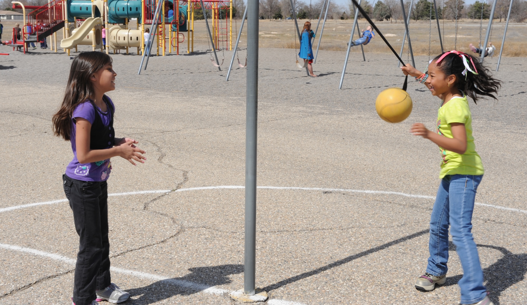 Two children play during recess April 3, 2013, at Mountain Home Air Force Base, Idaho. Throughout the month the base is spotlighting these children and the struggles they go through as military kids. (U.S. Air Force photo by Airman 1st Class Malissa Lott/Released)
