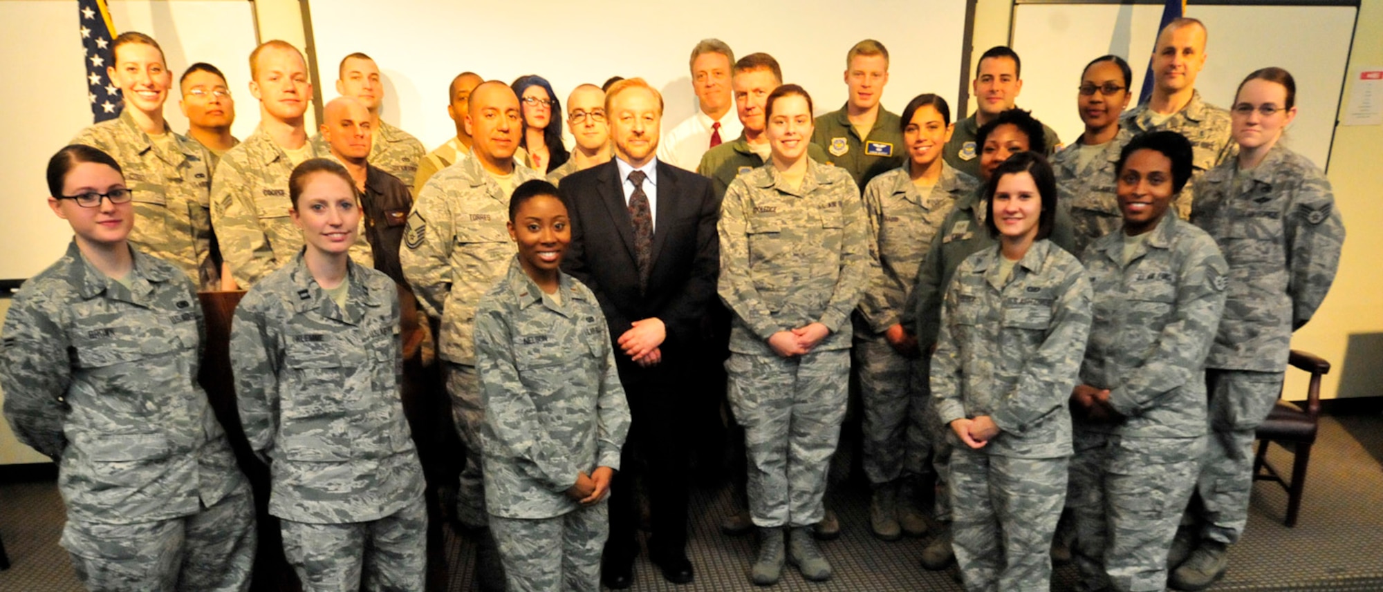 Members of the Holocaust Remembrance Week committee pose with Col. Cal Mercer, 436th Airlift Wing deputy commander, and Steve Gonzer, documentary filmmaker, following the Holocaust Remembrance Ceremony April 12, 2013, at Dover Air Force Base, Del. (U.S. Air Force photo/Tech. Sgt. Chuck Walker)