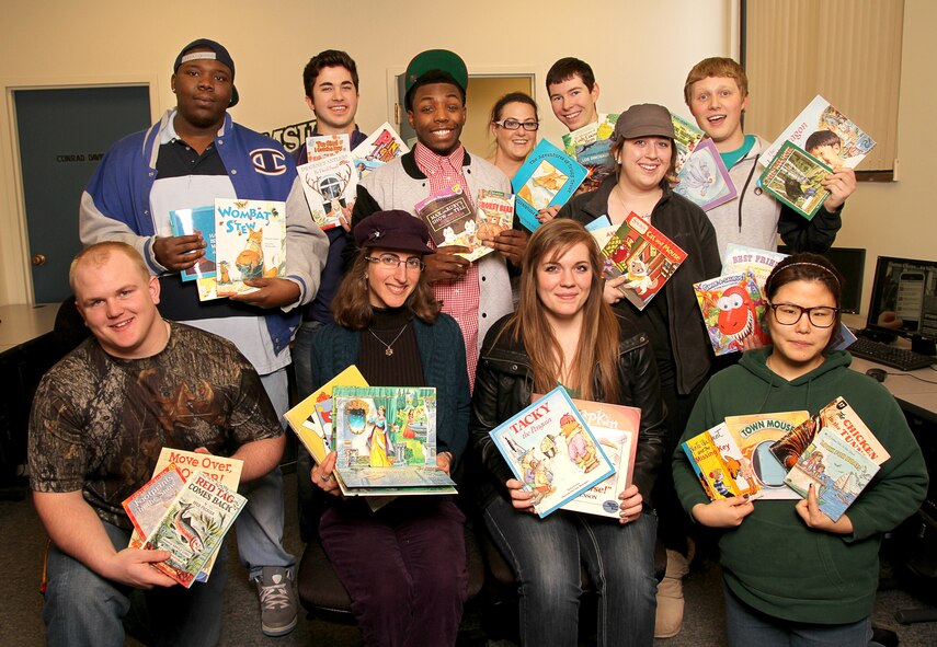 MINOT AIR FORCE BASE, N.D. -- Students in the COMM 324: Community Relations course developed their class project called "Voicebook-Reading for Rugrats," which is intended to help military service members who are deploying. The students gathered a collection of variously donated children’s books, and afterwards offer to military parents to audio record their voice, reading a particular children’s book. Students will be at Minot AFB to do audio recordings for parents from April 22 to April 24. (Courtesy photo)