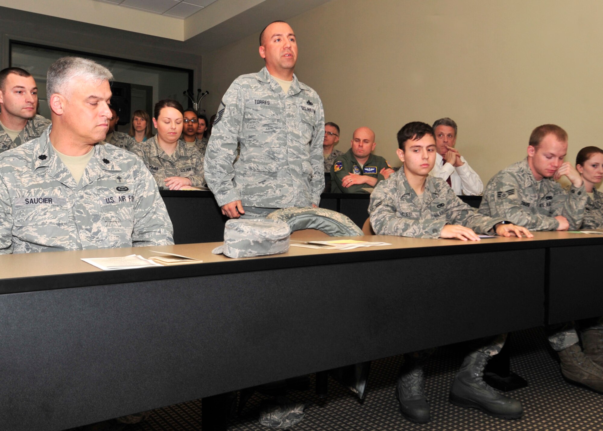 Master Sgt. Alfonso Torres, 436th Maintenance Squadron, recites a name during the Holocaust Remembrance reading of the names ceremony April 12, 2013, at Dover Air Force Base, Del. Holocaust Remembrance week remembers the victims of the Holocaust. (U.S. Air Force photo/Tech. Sgt. Chuck Walker)