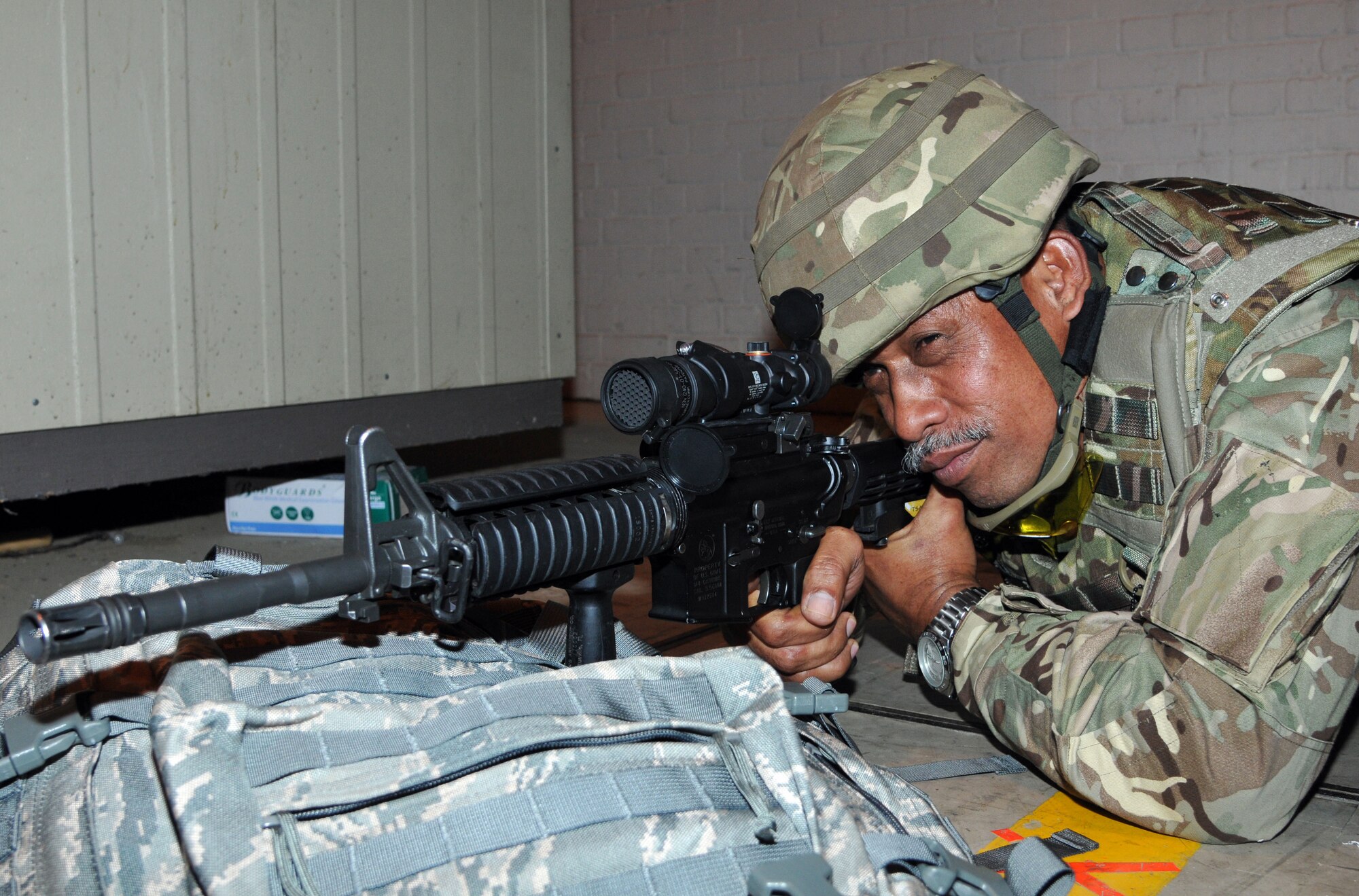 Tongan Defence Force Warrant Officer Taliauli Kafoa, Contention 6, who serves as the company sergeant major, zeros his sight during Advanced Combat Optics Gunsite training April 15, 2013, at RAF Honington, England. The ACOG workshop was part of joint training between the 100th Security Forces Squadron and the TDF. (U.S. Air Force photo by Airman 1st Class Kelsey Waters/Released)