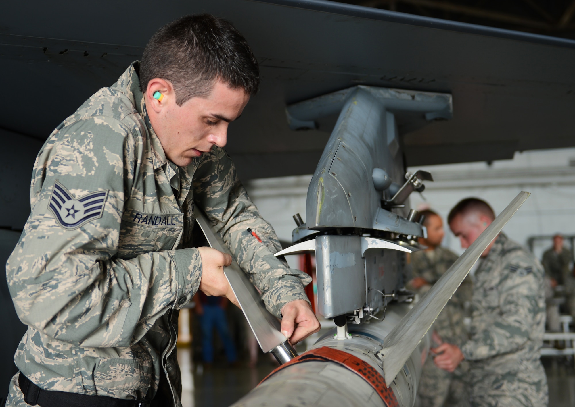 U.S. Air Force Staff Sgt. Richard Randall, 55th Aircraft Maintenance Unit ?Shooters,? weapons load crew chief, attaches a fin to an Air to Ground Missile-88 on an F-16 Fighting Falcon at Shaw Air Force Base, S.C., April 12, 2013. The 55th AMU ?Shooters? and 79th AMU ?Tigers? competed against one another during the Weapons Load Crew of the Year competition which is held once a quarter. (U.S. Air Force photo by Senior Airman Tabatha Zarrella/Released)
