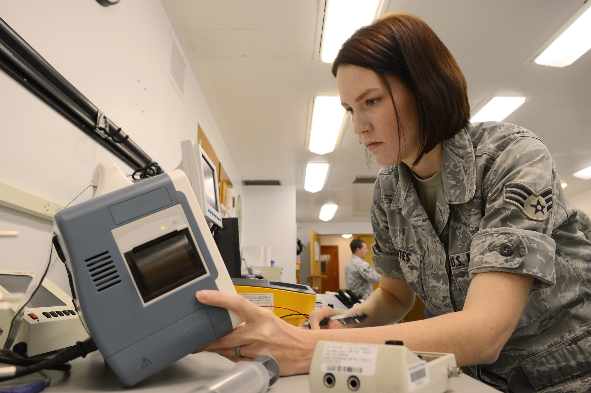 U.S. Air Force Senior Airman Lindsey Fuentes, 20th Medical Support Squadron biomedical technician, inspects a monitor at Shaw Air Force Base, S.C., April 11, 2013.  The biomedical lab in the 20th Medical Group is responsible for maintaining $7 million worth of medical equipment including the Shaw AFB Public Access Defibrillator program and the equipment at the base vet clinic.  (U.S. Air Force photo by Airman 1st Class Nicole Sikorski/Released)