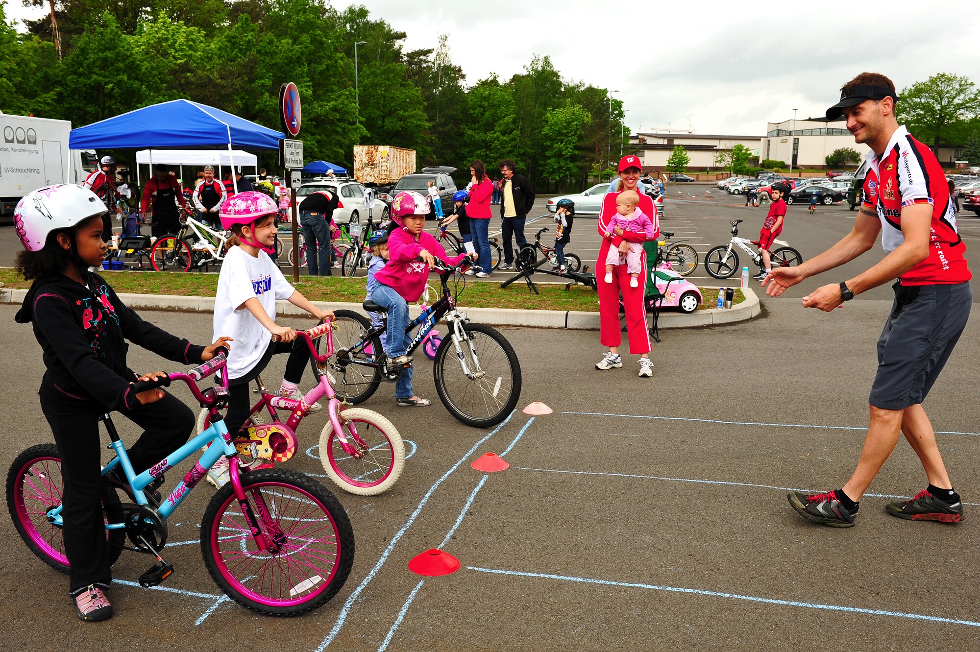 Children participate in the bicycle rodeo May 19, 2012, Ramstein Air Base, Germany. The rodeo was designed to teach children better biking skills. Children received bike inspections and safety, learned bicycle-handling skills and traffic rules. (U.S. Air Force photo/Airman 1st Class Holly Cook)