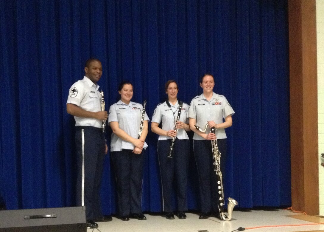 Members of the quartet pose for a photo after their performance. From left to right: MSgt Joshua Gates, A1C Charlan Rieve, SSgt Kristin Younkin, and SSgt Chantelle Friedman.