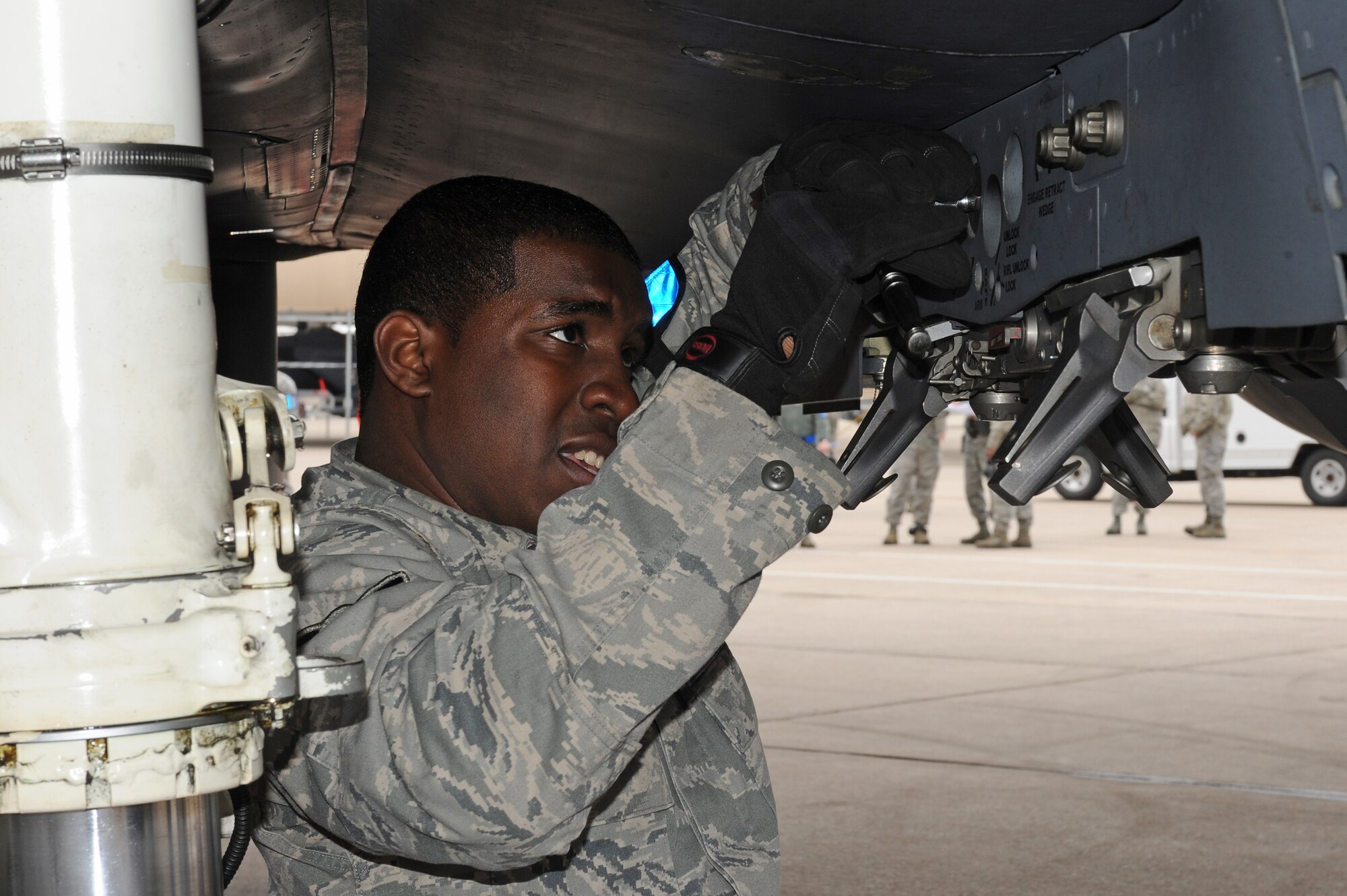 U.S. Air Force Airman 1st Class Manuel Wyley, 4th Aircraft Maintenance Squadron weapons load crew member, prepares an F-15E Strike Eagle weapons rack for munitions installation during a load crew competition on Seymour Johnson Air Force Base, N.C., April 5, 2013. Maintainers raced against the clock, and other load crew teams, while ensuring accuracy, serviceability and efficiency. (U.S. Air Force photo by Airman 1st Class John Nieves Camacho/Released)