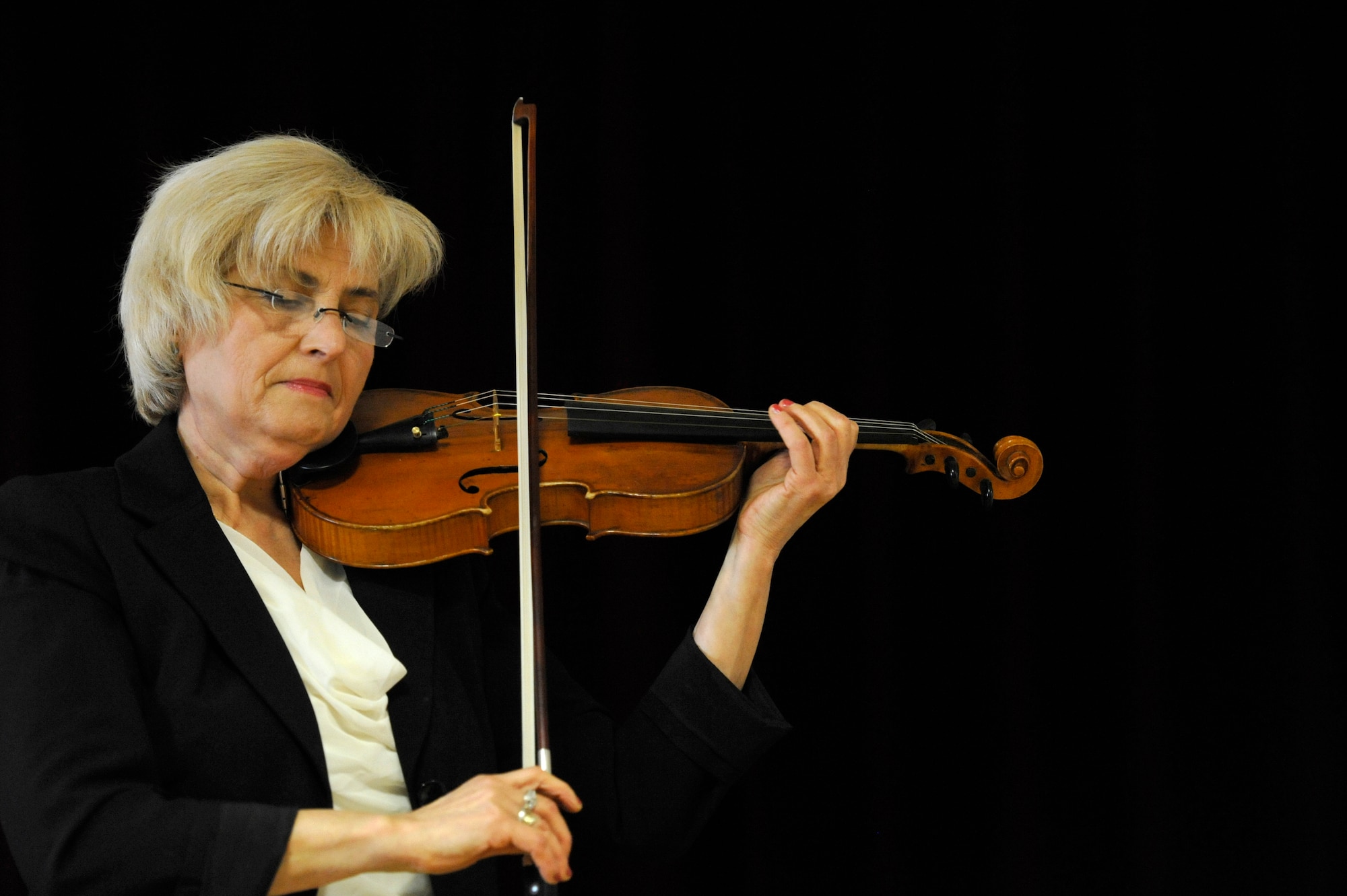 Alexandra Panchina, violinist, performs during the Holocaust day of remembrance event at the Ramstein Community Center, April 12, 2013. The event is aimed at remembering and honoring all the victims of the Holocaust. (U.S. Air Force photo/Senior Airman Aaron-Forrest Wainwright)