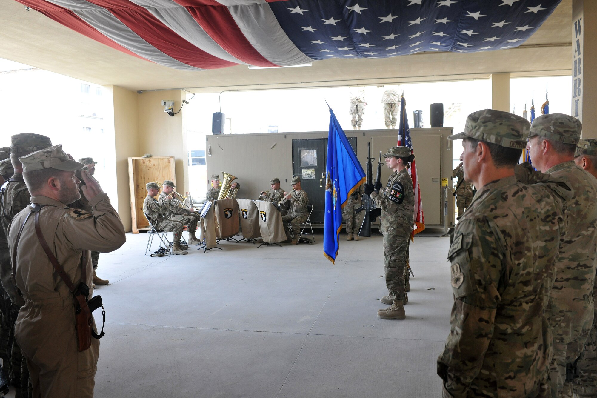 Members of the base honor guard present the colors during the 455th Expeditionary Medical Group change of command ceremony on Bagram Airfield, Afghanistan, April 12, 2013. Brig. Gen. Joseph Guastella, 455th Air Expeditionary Wing commander, and Col. Koji Nishimura, Task Force Medical- Afghanistan commander, presided over the ceremony, passing the guidon of the 455th Expeditionary Medical Group and the guidon of Task Force Medical East to its new commander Col. Dominic DeFrancis. (U.S. Air Force photo/Senior Airman Chris Willis)