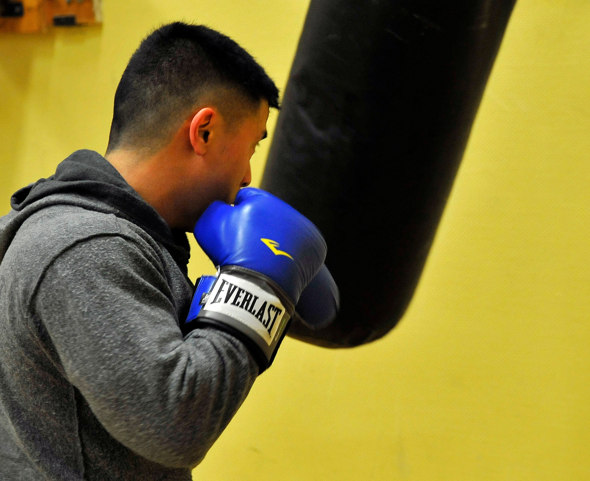 Capt. Larry Cornelio,786th Civil Engineer Squadron Kaiserslautern Operations Flight commander, trains on the heavy punching bag, Feb. 27, 2013, Miesau Army Depot, Germany. The combination of cardio, cross training and strength training makes boxing a great alternate workout for any fitness level. (U.S. Air Force photo/Airman 1st Class Trevor Rhynes)