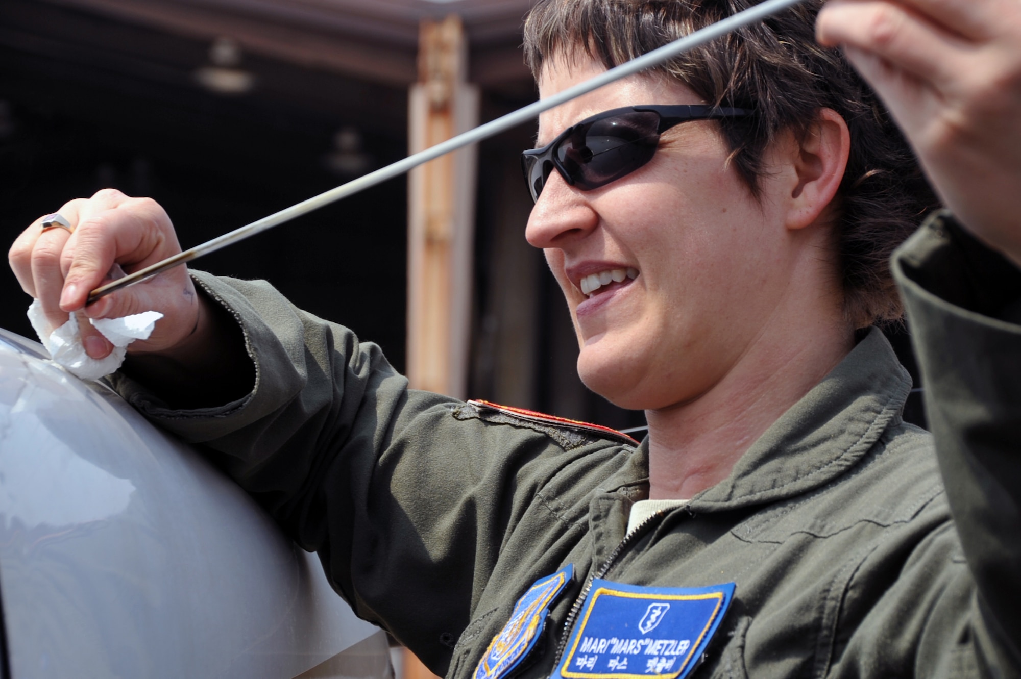 Capt. Mari Metzler, 51st Medical Group aerospace and operational physiologist flight commander, checks the oil on a 1983 Cessna 172 before flight at the Osan Flight Training Center on Osan Air Base, Republic of Korea, April 8, 2013. Pilots must complete multiple pre-flight checklists to ensure aircraft are ready for flight before takeoff. (U.S. Air Force photo/Senior Airman Alexis Siekert)