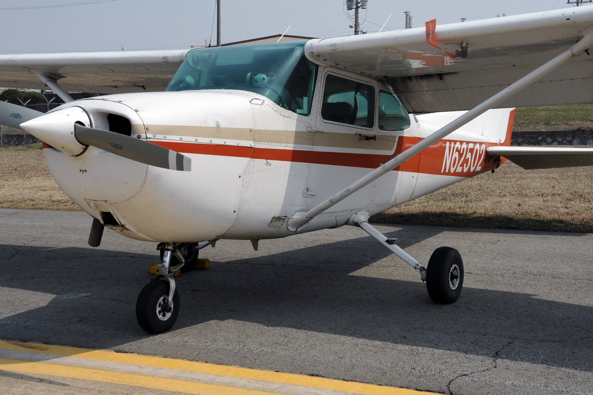 A 1983 Cessna 172 awaits flight at the Osan Flight Training Center on Osan Air Base, Republic of Korea, April 8, 2013. The Aero Club has two functioning Cessnas available for rent to Osan members to use for training or recreational activities. (U.S. Air Force photo/Senior Airman Alexis Siekert)
