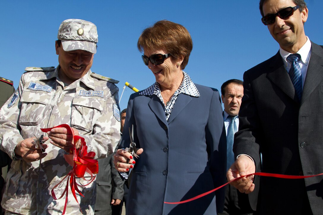 From left: Lt. Gen. Sherali Mirzo, Tajikistan’s commander of border guards; Susan Elliott, U.S. ambassador to Tajikistan; and Khaled Masoud, the Middle East District’s lead engineer for work in the Central Asian States, celebrate the opening of two new border guard facilities in Tajikistan during a ribbon-cutting ceremony Nov. 6.