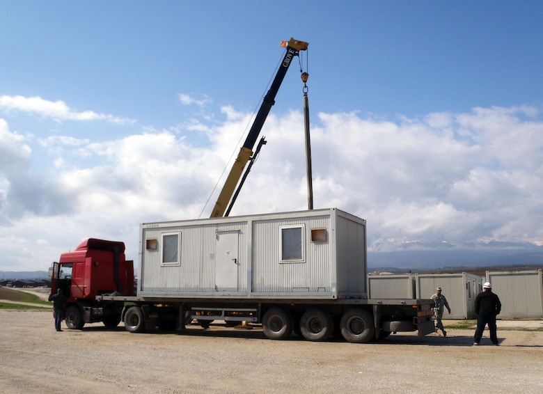 KBR Inc. employees in Kosovo prepare a truck to move equipment. Driving in support of the USAREUR Support Contract, truck drivers have travelled more than four million miles without a recordable accident, which is one of the reasons KBR Inc. received the Middle East District’s Superior Safety Performance Award.