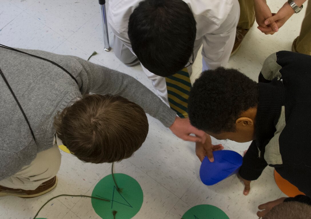 Students solve a puzzle during a Marine Corps Leadership Seminar aboard Wake County Young Men’s Leadership Academy in Raleigh, N.C., April 11. The Marine Corps Leadership Seminar has been hosted by colleges and universities across the country for the past three years; however, this is the first time the event has been hosted at a high school.