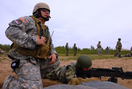 A Soldier of 63rd Parachutist Battalion, Special Forces Brigade fires a 240 B squad operating weapon June 12 on a Camp Grayling, Mich. range. The Soldiers were participating in the National Guard Bureau State Partnership Program (SPP) between Ohio and the Republic of Serbia. The Serbian soldiers will train with Company B, 2nd Battalion, 19th Special Forces Group for two weeks on mission planning, weapons systems and demoing among other tasks and skills. This training is the second half of the State Partnership Plan developed in fall of 2006. In September of 2007, U.S. Special Forces traveled to Serbia to familiarize with Serbian military operations.