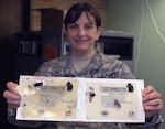 Capt. Karen Corsetti, a Georgia Army National Guard environmental officer and trained entomologist, shows how her eco-friendly insect trap help to trap and kill cockroaches with out harming the environment and saving the Guard millions of dollars. 