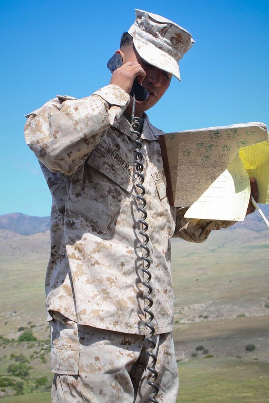 Lance Cpl. Luis Herrera, a forward observer serving with 2nd Battalion, 11th Marine Regiment, calls in a fire mission to the gun line while conducting a training and readiness examination during a live-fire exercise here, April 3, 2013. Herrera, a 23-year-old-native of Chino, Calif., and his fellow forward observers are training to deploy with the 31st Marine Expeditionary Unit.