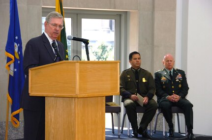 W. Ralph Basham, commissioner of U.S. Customs and Border Protection (CBP), addresses an Operation Jump Start (OJS) end-of-mission ceremony at the Ronald Reagan Building and International Trade Center in Washington on July 11, 2008, as David V. Aguilar, chief of the United States Border Patrol, and LTG H Steven Blum, chief of the National Guard Bureau, listen. The National Guard has provided support to CBP for more than 20 years. At its peak, up to 6,000 Citizen-Soldiers and -Airmen increased security and vigilance along the nation's southern border under OJS, which began June 15, 2006, and ended July 15, 2008. The National Guard and CBP will continue to work together on engineering, counterdrug and other missions.