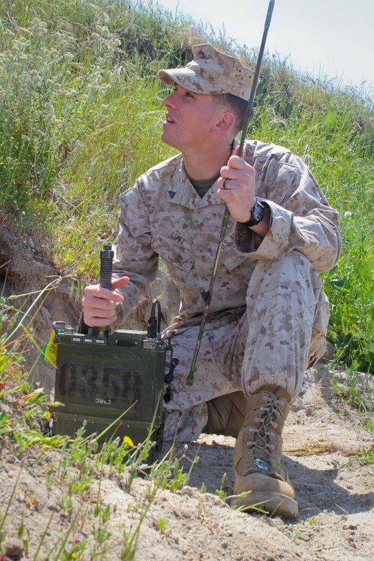 Corporal David Lutz, a radio operator serving with 2nd Battalion, 11th Marine Regiment, sets up field radio communications for Marine forward observers during a live-fire exercise here, April 3, 2013. Lutz, a 22-year-old-native of Mogadore, Ohio, and his fellow forward observers are training to deploy with the 31st Marine Expeditionary Unit.