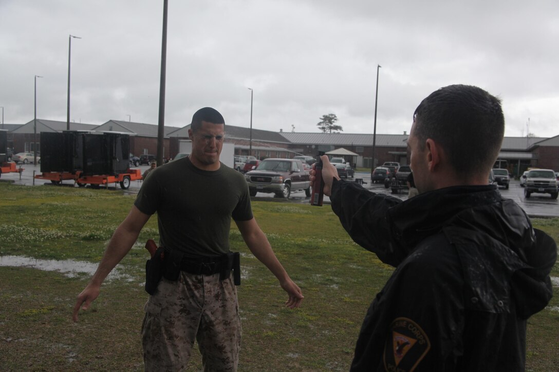 Lance Cpl. Vincent M. Shaw, a military police officer with the Provost Marshall Office, is sprayed with OC Spray during a PMO OC Spray at PMO April 12. “This was the most intense feeling I have ever felt,” said Shaw, moments following getting sprayed in the eyes with OC Spray. “It was like I had the worst case of dry eyes in my life and couldn’t get rid of it.”