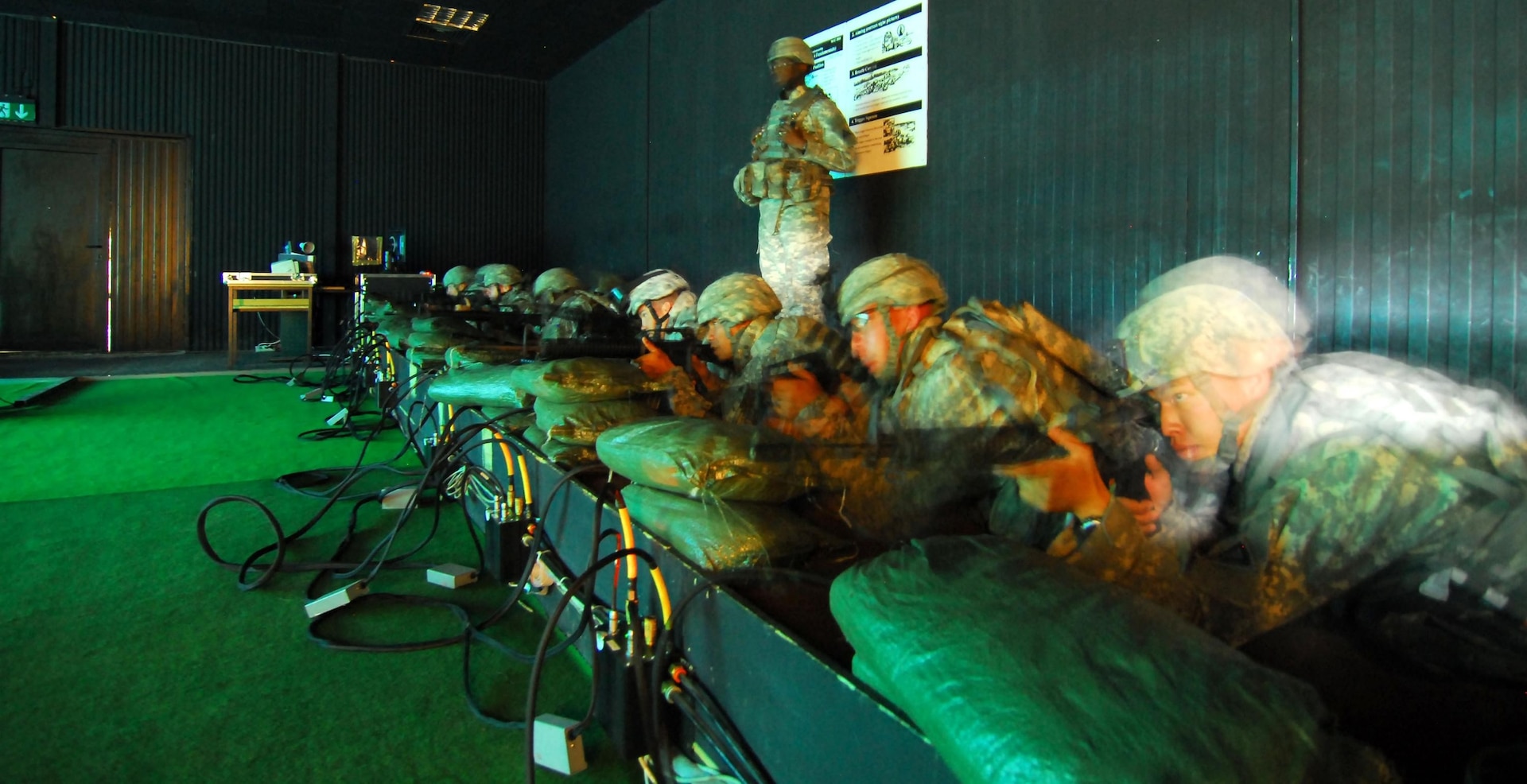 Soldiers train on the Engagement Skills Trainer 2000 at Mihail Kogalniceanu Airbase, Romania. Some 900 Soldiers are now in Romania, as part of Joint Task Force - East, to conduct training there with members of the Romanian military.