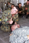 A Soldier from the Georgian army's 4th infantry Brigade lets his combat lifesaver instructor know he's completed the steps necessary for giving mouth-to-mouth resuscitation to Pvt. Daniel Williams, an infantryman with Company D, 1st Battalion, 121st Infantry.