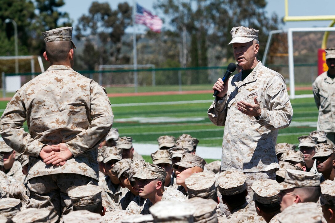 Gen. James F. Amos, the 35th commandant of the Marine Corps, answers Lance Cpl. Jonathan A. Lira's question about leadership qualities during a visit to Camp Pendleton where hundreds of Marines were in attendance here April 17.