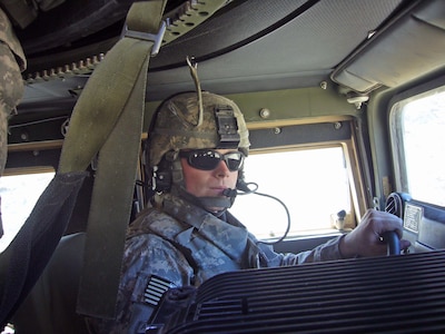 Cpl. Wesley Burgess of the New York Army National Guard seen in the driver's seat of an up armored humvee. Burgess and his teammates are currently serving as part of Combined Joint Task Force Phoenix in Afghanistan.