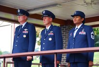 From left, Lt. Gen. Craig R. McKinley, director of the Air National Guard, Col. Michael L. Waggett, commander of the Air Guard's I.G. Brown Training and Education Center (TEC) and Chief Master Sgt. Deborah Davidson, TEC enlisted education commandant, watch a pass and review of Noncommissioned Officer Academy students July 31 during the TEC's 40th anniversary celebration at McGhee Tyson Air National Guard Base, Tenn.