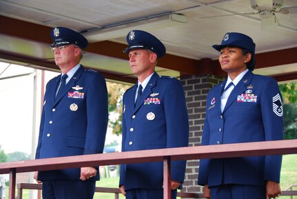 From left, Lt. Gen. Craig R. McKinley, director of the Air National Guard, Col. Michael L. Waggett, commander of the Air Guard's I.G. Brown Training and Education Center (TEC) and Chief Master Sgt. Deborah Davidson, TEC enlisted education commandant, watch a pass and review of Noncommissioned Officer Academy students July 31 during the TEC's 40th anniversary celebration at McGhee Tyson Air National Guard Base, Tenn.