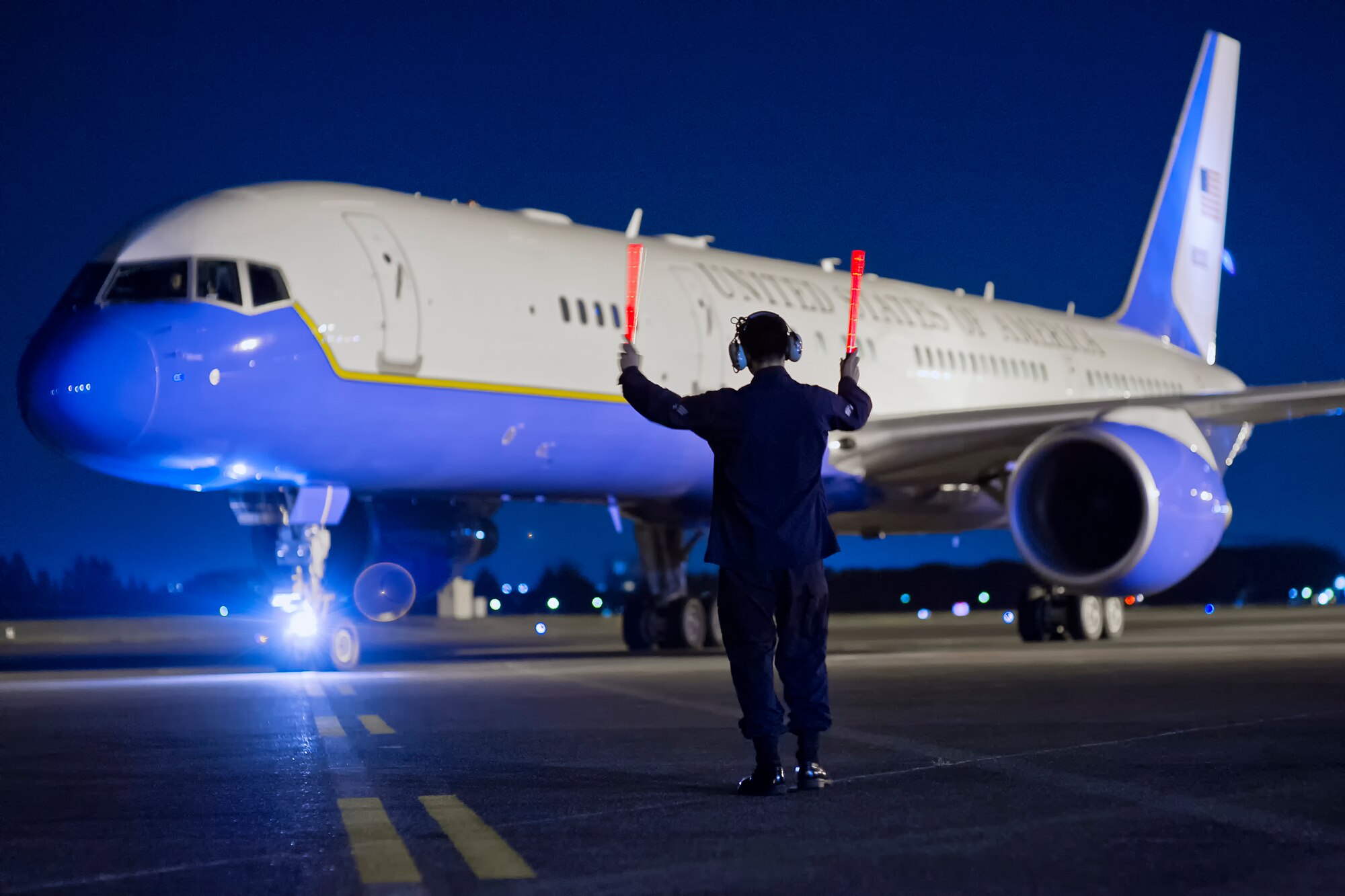 YOKOTA AIR BASE, Japan -- Senior Airman Andres Samaniego, 374th Maintenance Squadron Transient Alert technician, marshals a C-32 aircraft at Yokota Air Base, Japan, Oct. 28, 2011. (U.S. Air Force photo/Osakabe Yasuo) 
