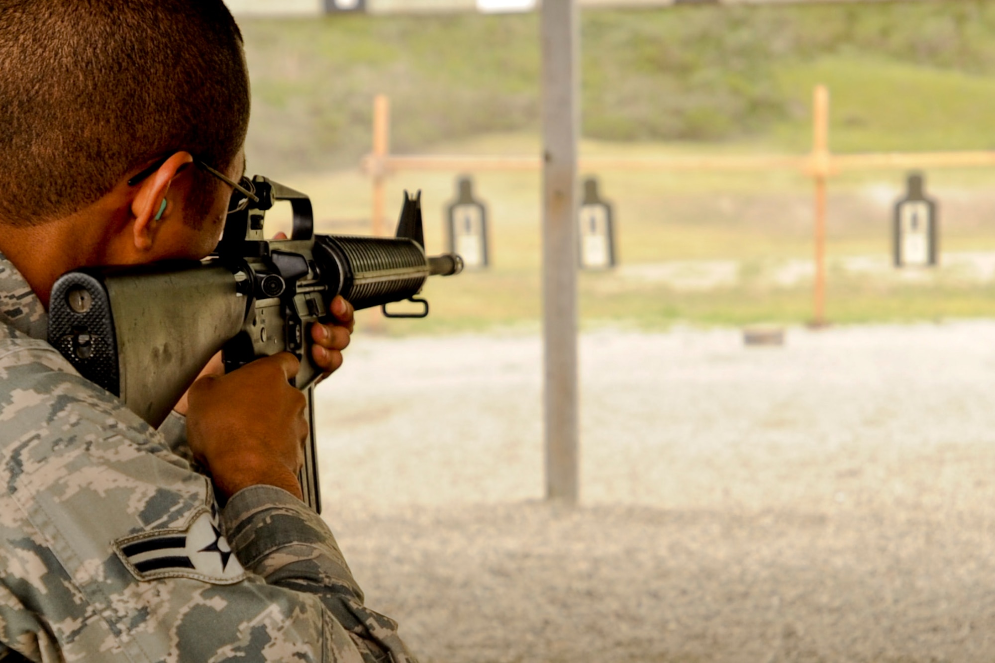 VANDENBERG AIR FORCE BASE, Calif. – Airman 1st Class Thomas Wingfield, 614th Air and Operation Center space intel analyst, aims before firing during an Elementary Level Excellence Competition here Monday, April 15, 2013. The 30th Security Forces Squadron Combat Arms Training instructors held a two day competition for rifles and pistols, which was open to all base military members willing to shoot. (U.S. Air Force photo/Airman Yvonne Morales)