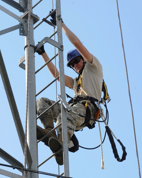 Senior Airman Michael Maner, 2nd Communications Squadron cable antenna maintenance, climbs down a tower on Barksdale Air Force Base, La., April 17, 2013. Airmen from 2 CS cable antenna maintenance are responsible for maintaining all physical and fiber optic structures. There is a total of 90,000 miles of cable on base. (U.S. Air Force photo/Senior Airman Sean Martin)