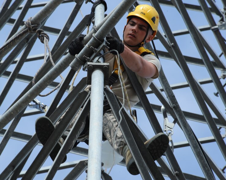 Airman Roland Perkins, 2nd Communications Squadron cable antenna maintenance, works on a tower on Barksdale Air Force Base, La., April 17, 2013. The tower will be used for training for 2 CS Airmen. (U.S. Air Force photo/Senior Airman Sean Martin)