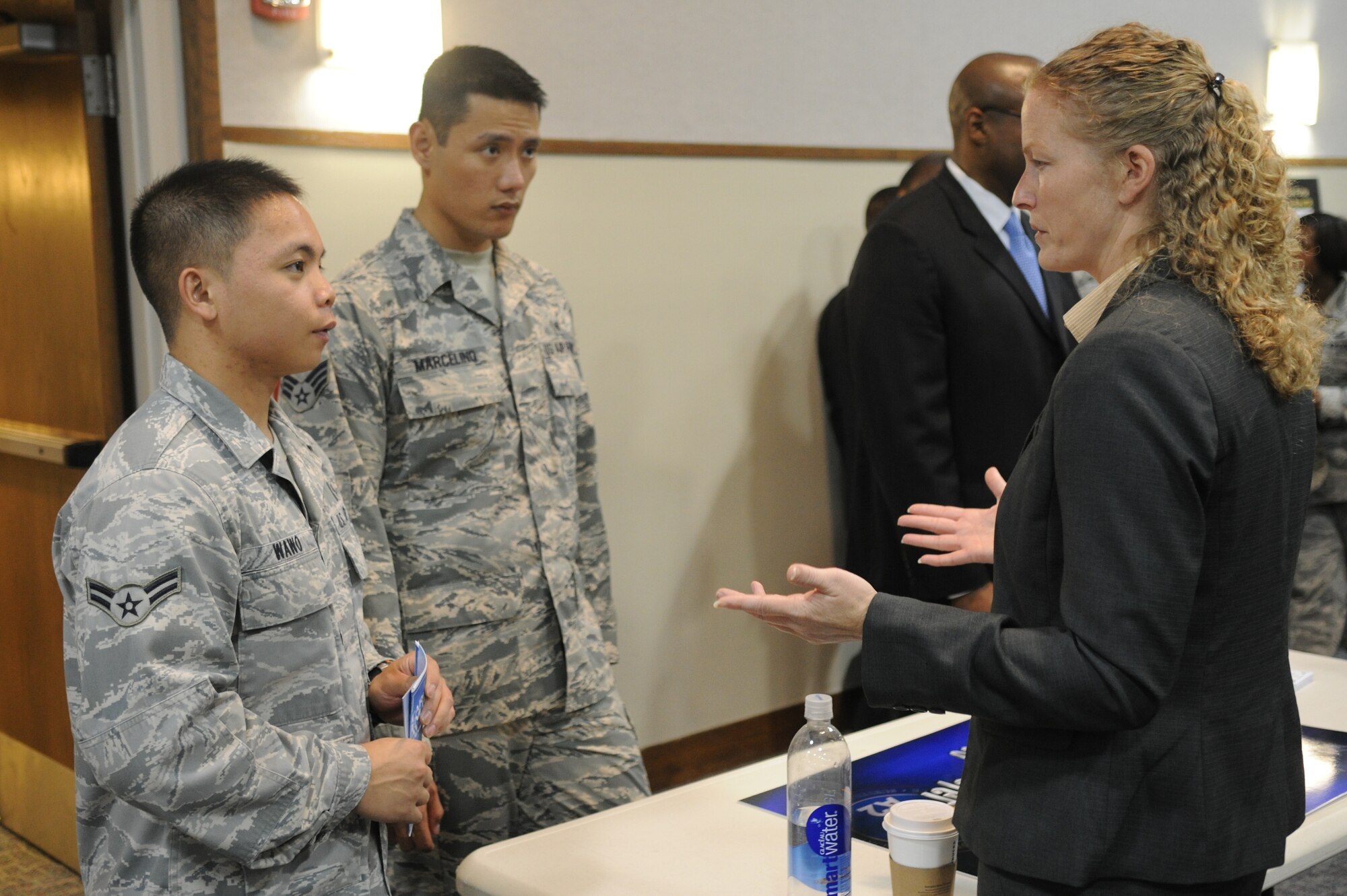 Airman 1st Class Devid Wawo, 779th Medical Group medical logistician, speaks with a representative of HUMINT Program Strategic Debrief about career opportunities here on April 16. (Photo released Airman 1st Class Joshua R. M. Dewberry) 