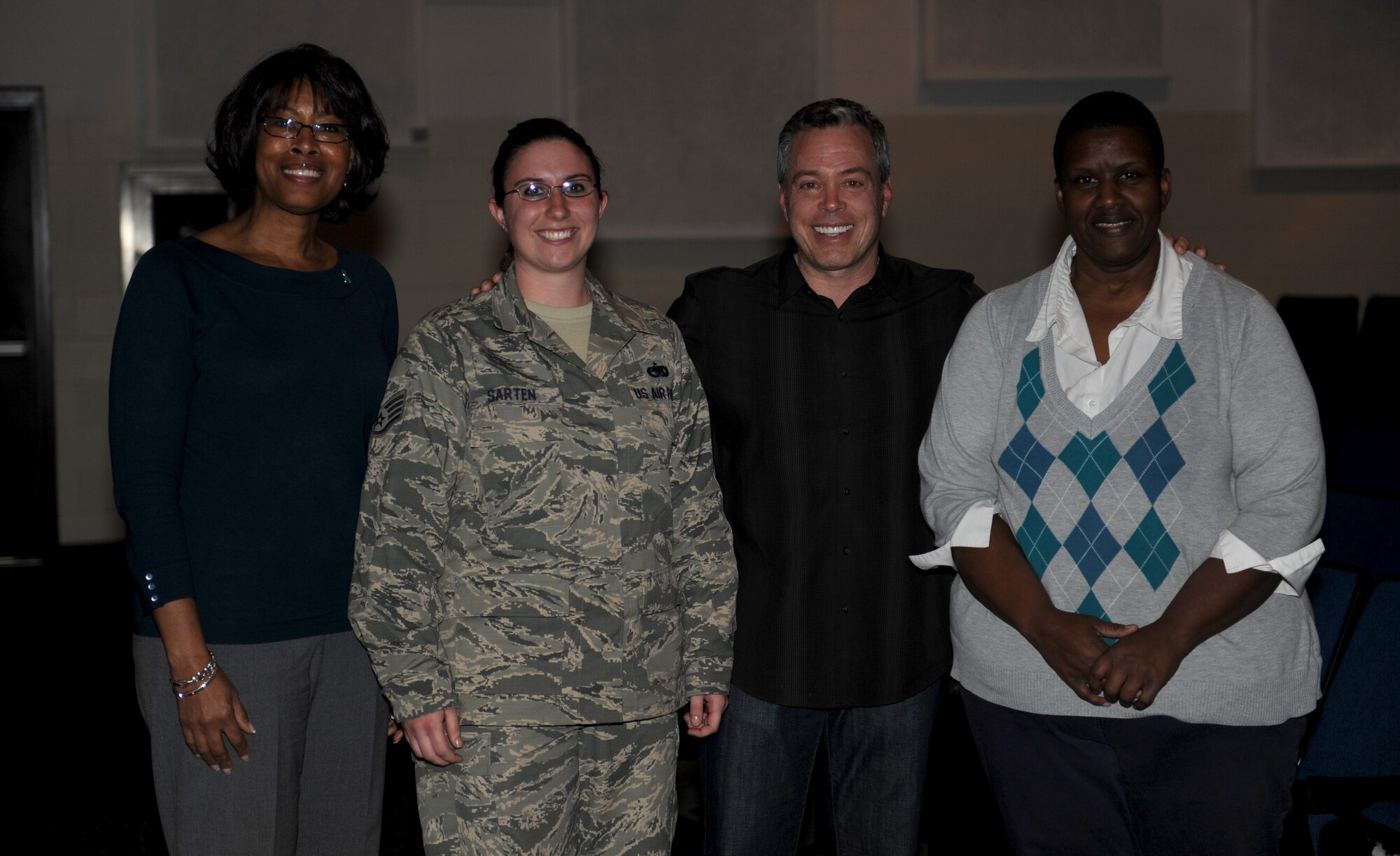 Pamela Dorsey, 375th sexual assault response coordinator, Staff Sgt. Sarah Sarten, sexual assault victim advocate, and Laverne Foster, meet with Bernie McGrenahan after his "Happy Hour" comedy tour April 11 at the base auditorium.  The SARC worked closely with McGrenahan to make this event a success, and to help raise sexual assault awareness. (U.S. Air Force photo/Staff Sgt. Maria Bowman)