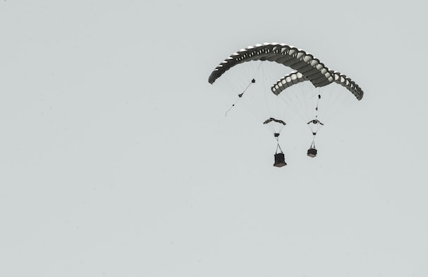 Two Joint Precision Airdrop System bundles (JPADS) glide toward their designated drop zone during the first Big Country JPADS Capabilities Training Exercise April 11, 2013, at Fort Hood, Texas. Benefits to using JPADS include an increase in the number of available drop zones and the cargo's precision, which can be guided to designated targets with pinpoint accuracy. (U.S. Air Force photo/Airman 1st Class Jonathan Stefanko)