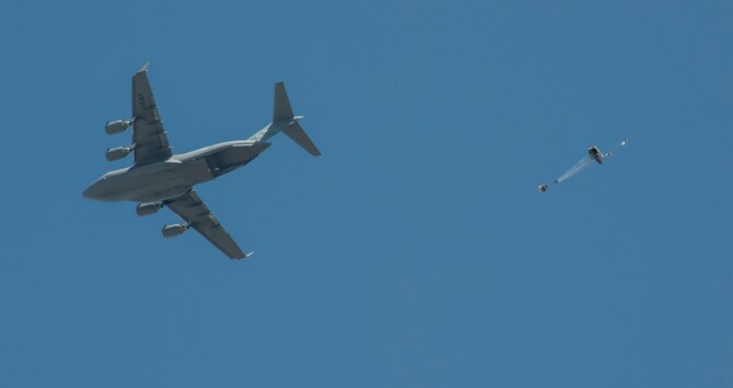 A C-17 assigned to the 62nd Airlift Wing, Joint Base Lewis-McChord, Wash., drops a Joint Precision Airdrop System (JPADS) bundle during the first Big Country JPADS Capabilities Training Exercise April, 11, 2013, at Fort Hood, Texas. JPADS is a system that can be dropped and guided from as high as 25,000 feet with pinpoint accuracy, allowing the aircraft to safely avoid enemy ground fire. (U.S. Air Force photo/Airman 1st Class Jonathan Stefanko)