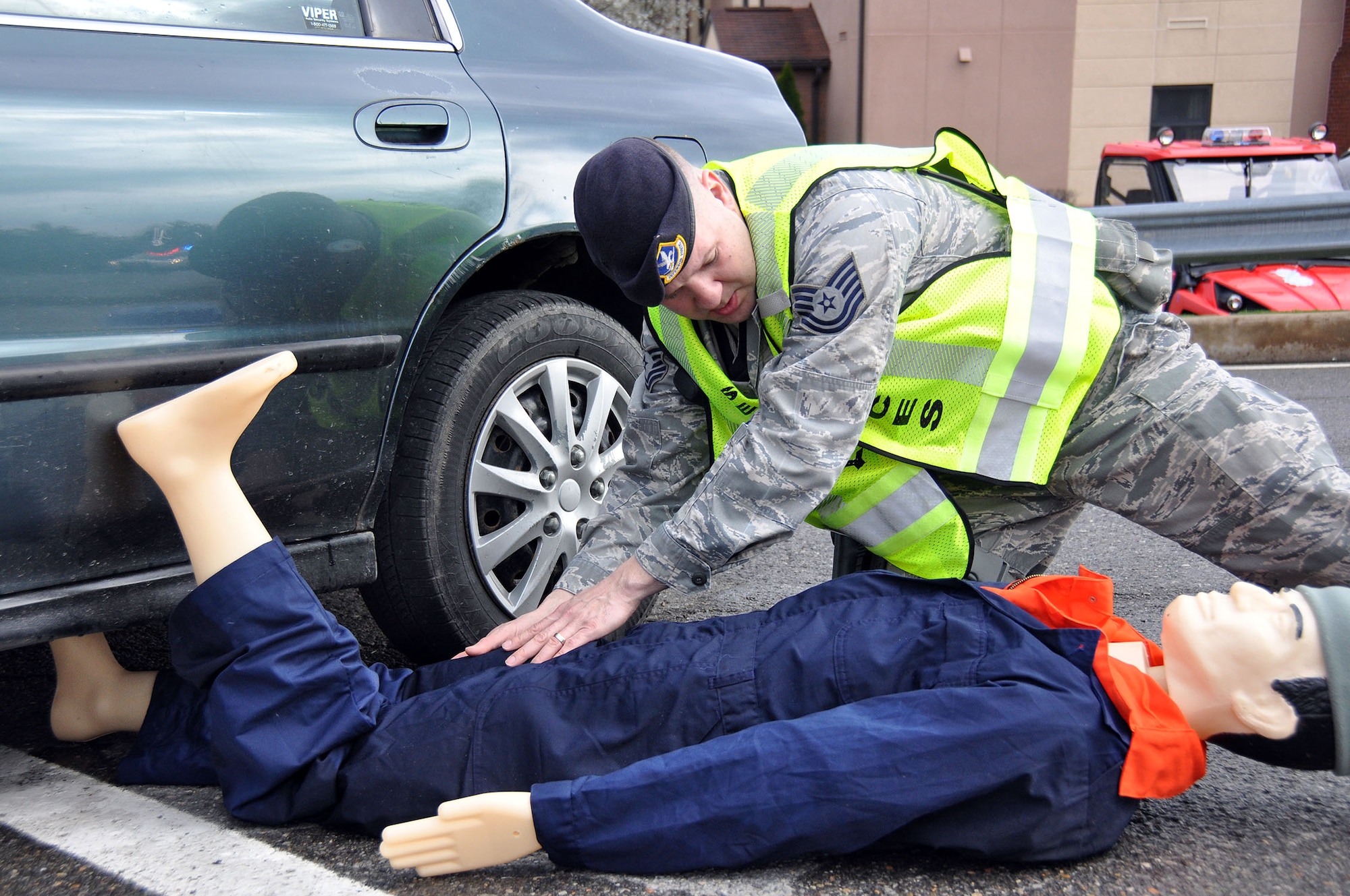 Tech. Sgt. James Stamos, 911th Security Forces Squadron patrolman, performs an initial assessment on a microburst victim during a Major Accident Response Exercise (MARE) held at the Pittsburgh International Airport Air Reserve Station, Apr. 16, 2013.  The natural disaster exercise training included Navy Operational Support Center - Pittsburgh Naval Security Forces personnel, Allegheny County fire fighters, and EMS personnel.  MARE training can also simulate a variety of other events; such as an aircraft crash, an explosion or terrorist attack.  The goal of these types of exercises is to test the readiness and response capabilities of 911th personnel. (U.S. Air Force photo by Capt. Shawn M. Walleck)
