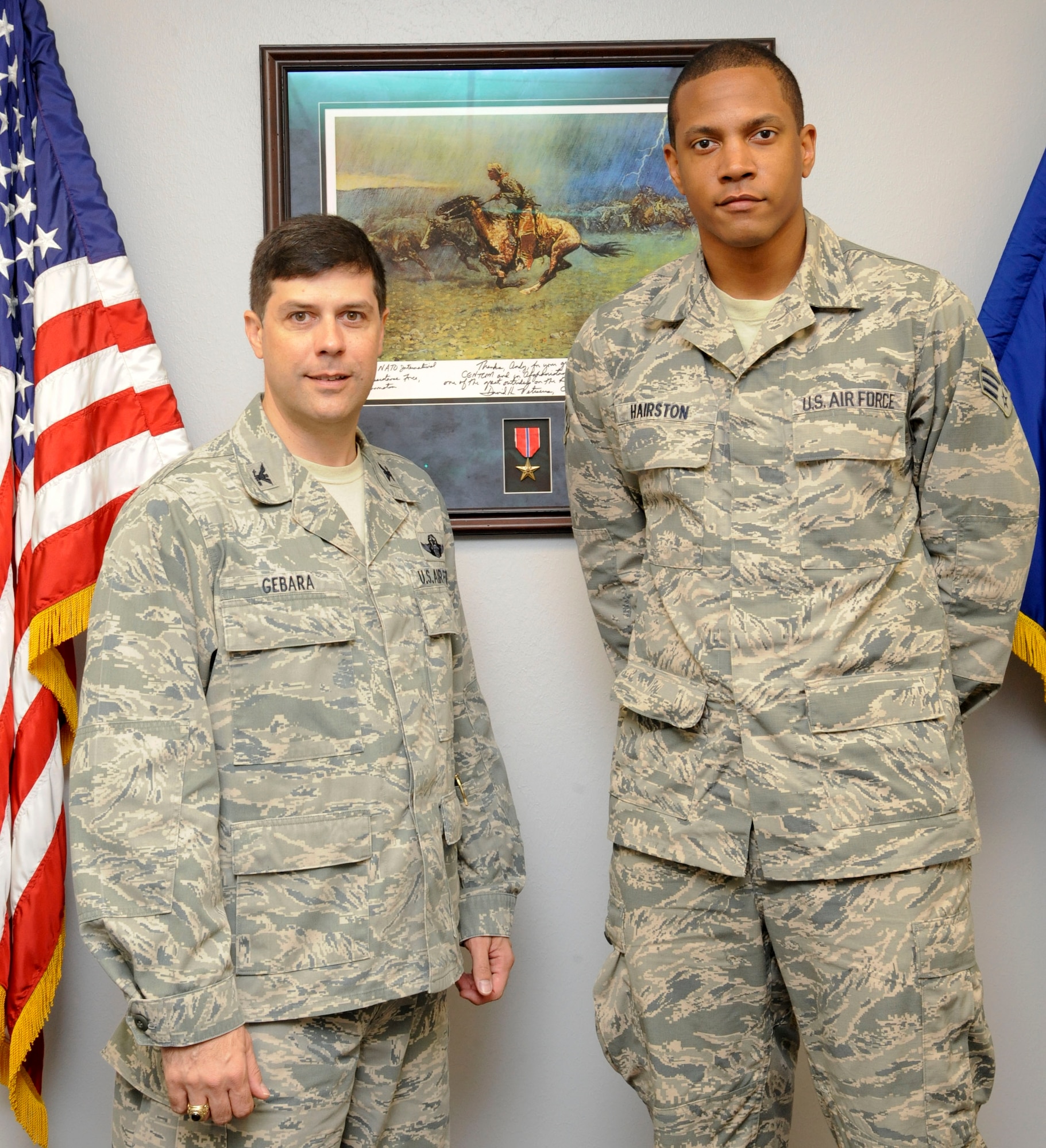 Col. Andrew Gebara, 2nd Bomb Wing commander, stands with the Airman of the Month winner for March, Senior Airman Jeffery Hairston, 2nd Contracting Squadron, on Barksdale Air Force Base, La., April 17, 2013. Each month, Barksdale selects one of many nominated Airmen who have displayed exemplary service on and off-duty for the AOM. (U.S. Air Force photo/Airman 1st Class Andrew Moua)