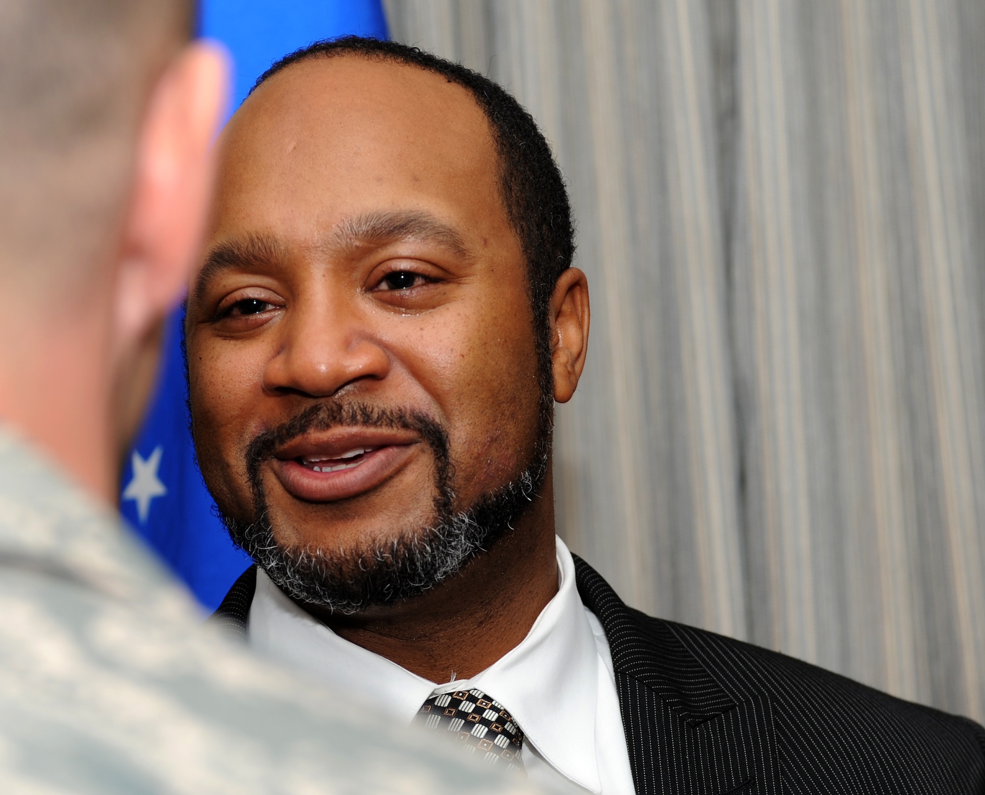 U.S. Air Force Reserve Maj. Damon Taylor thanks those who came to support his family during a dedication ceremony for Taylor Loop Road at Langley Air Force Base Va., April 12, 2013. Damon was only nine years old when his father, Senior Master Sgt. Ernest Taylor, was killed in a hit-and-run accident while on a run in Bethel Manor Housing. (U.S. Air Force photo by Senior Airman Teresa Aber/Released)