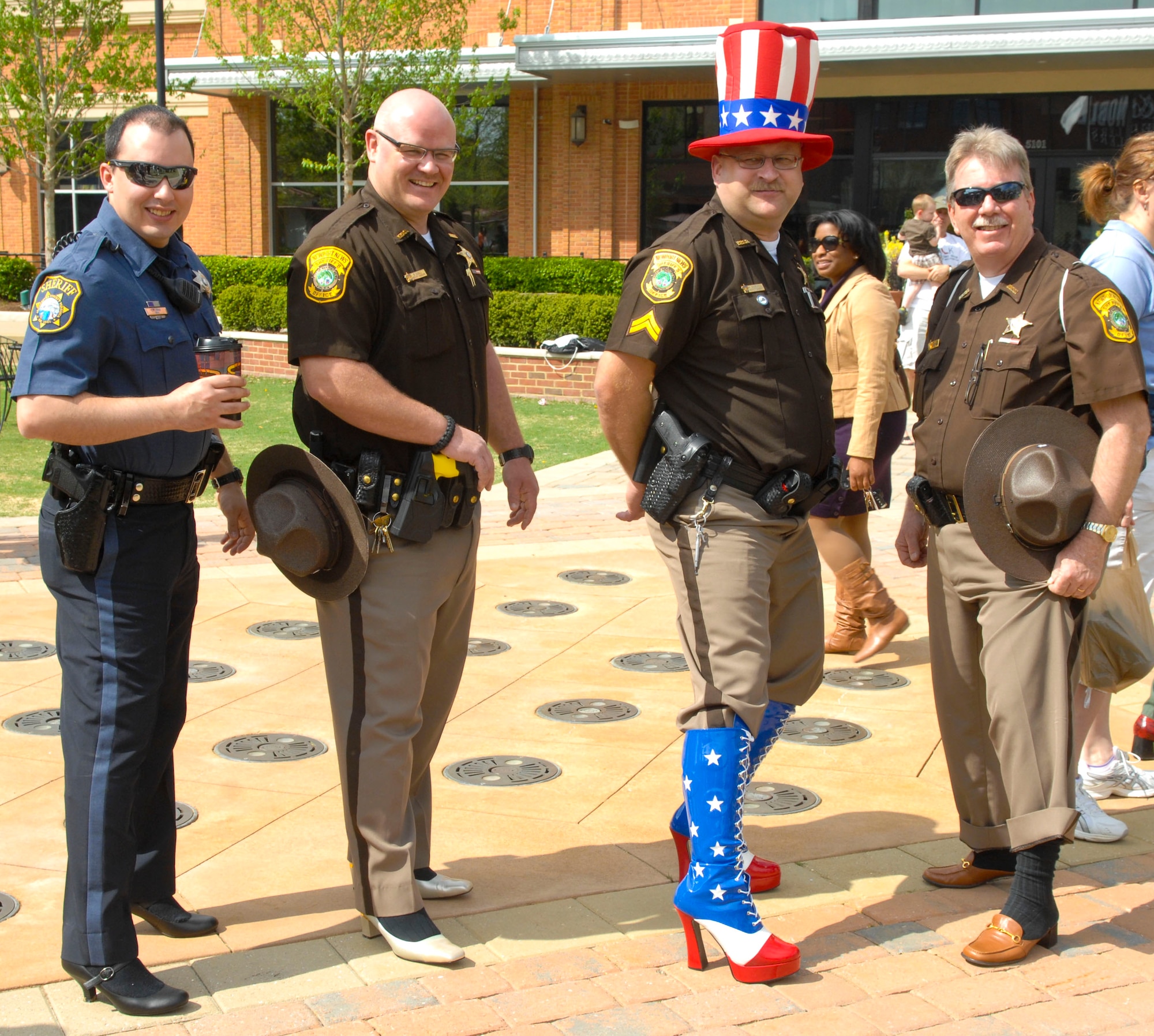 Policeman from across Hampton Roads came out to walk during the “Walk a Mile in Her Shoes” event in Hampton, Va., April 13, 2013. Each year, officers from the different cities and sheriff’s departments form teams to raise money for the cause. (U.S. Air Force photo by Airman 1st Class Austin Harvill/Released)