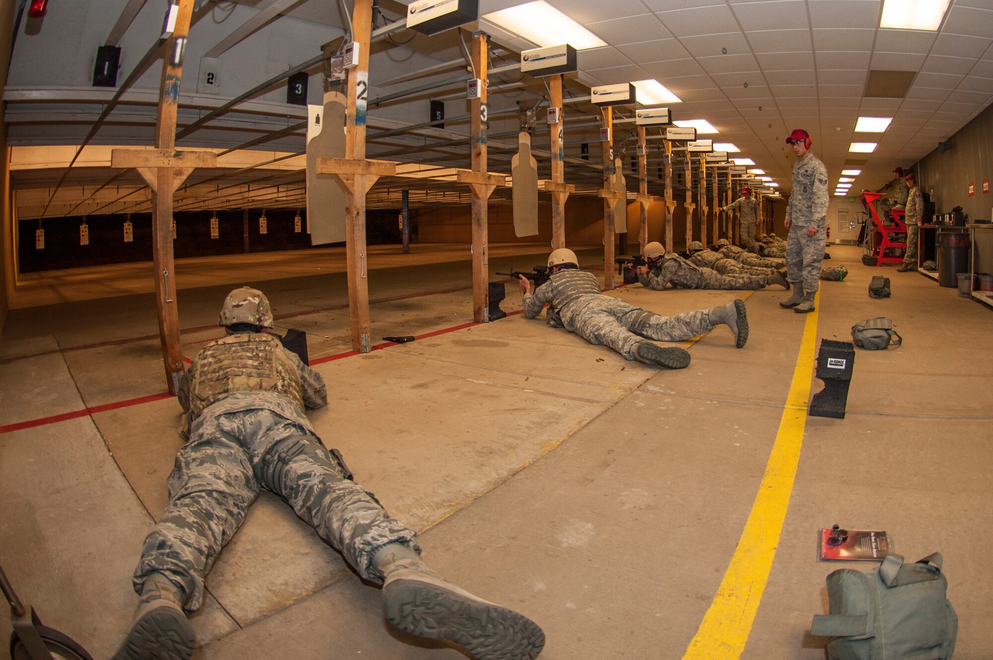 Explosive Ordnance Disposal Airmen receive new training here this weekend. They are required to be dual qualified on the M-4 carbine and the M-9 handgun. (U.S. Air Force photo/Senior Airman Crystal Charriere)