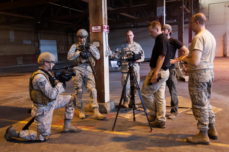 Second Combat Camera Squadron members prepare for a scene during the production of "2nd Combat Camera in Action." The video recently took top honors at the 23rd International Defence Film Festival in Rome. Earlier this year, it won "Production of the Year" in the 2012 Visual Information Production Awards, an annual Department of Defense competition. (U.S. Air Force photo/Trevor Wood) 
