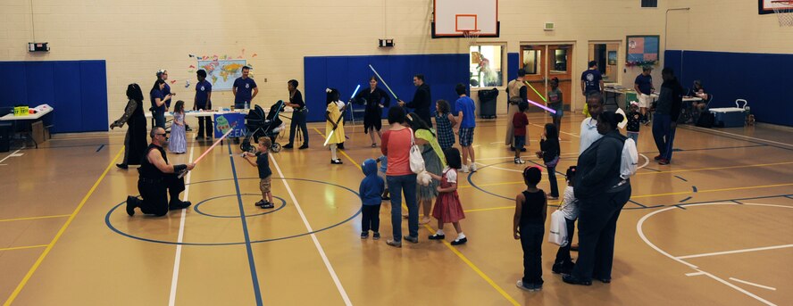 Military families attend the Books on Bases event at the Youth Center on Barksdale Air Force Base, La., April 13, 2013. The event promotes reading within military families and was held as part of Month of the Military Child. (U.S. Air Force photo/Senior Airman Sean Martin)