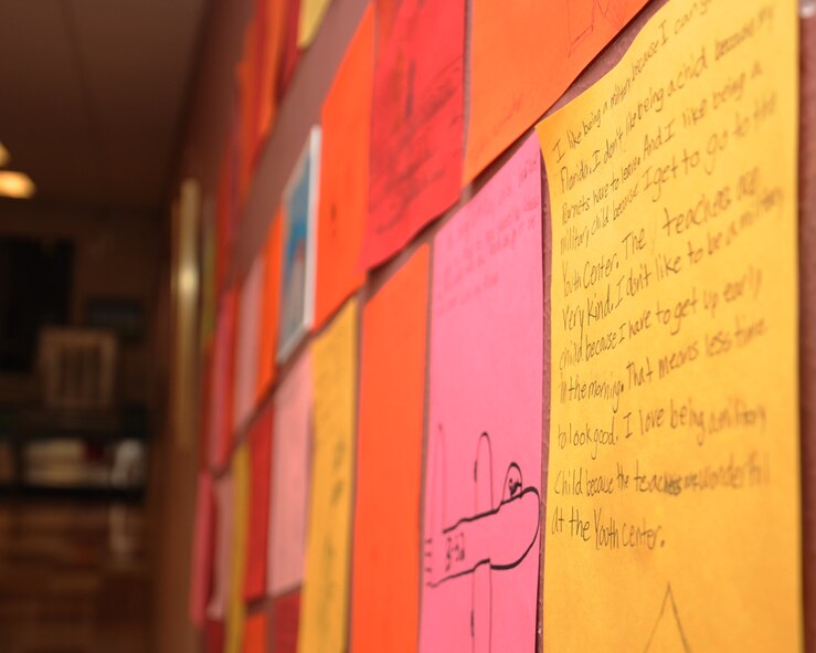 Letters from children are displayed at the Youth Center on Barksdale Air Force Base, La., April 13, 2013. The letters were about what it feels like to be a military child. Books on Bases was held to bring military families together to promote families reading together. (U.S. Air Force photo/Senior Airman Sean Martin)