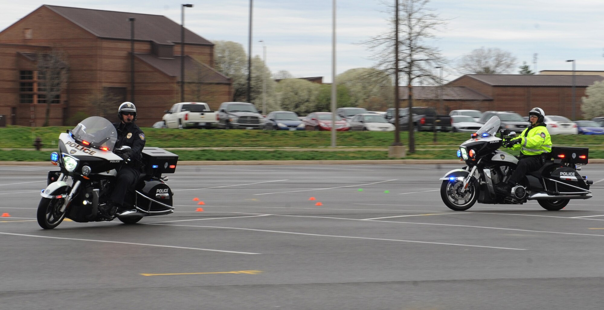 Members of the Lee’s Summit Police Department navigate “Grant’s Gauntlet” during the annual Motorcycle Awareness and Safety Day at Whiteman Air Force Base, Mo., April 15, 2013. Grant’s Gauntlet is a timed riding course that tests stopping and turning skills of riders.  (U.S. Air Force photo by Airman 1st Class Bryan Crane/Released)